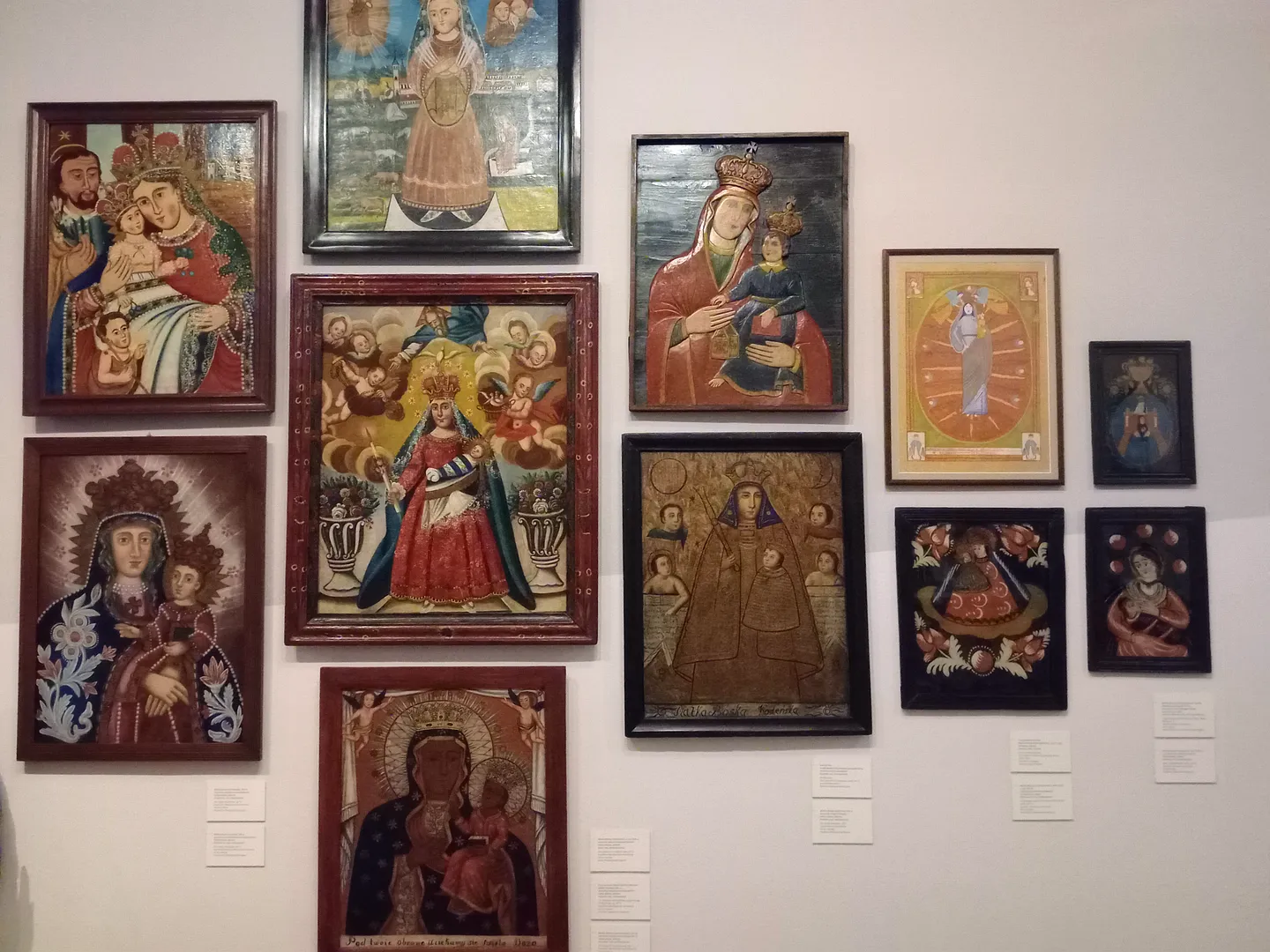 A collection of religious paintings depicting various saints and Madonna figures