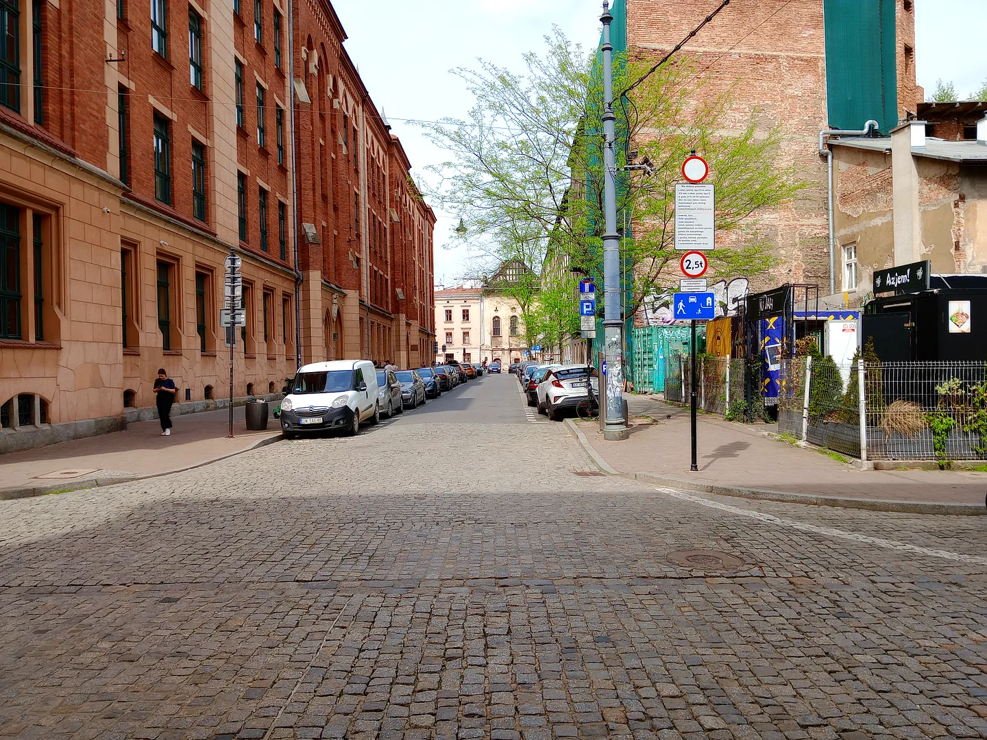 Wąska street view with Judah Food Market on the right